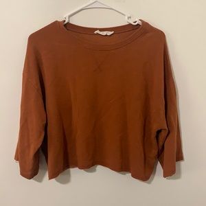 Rustic orange T-shirt.